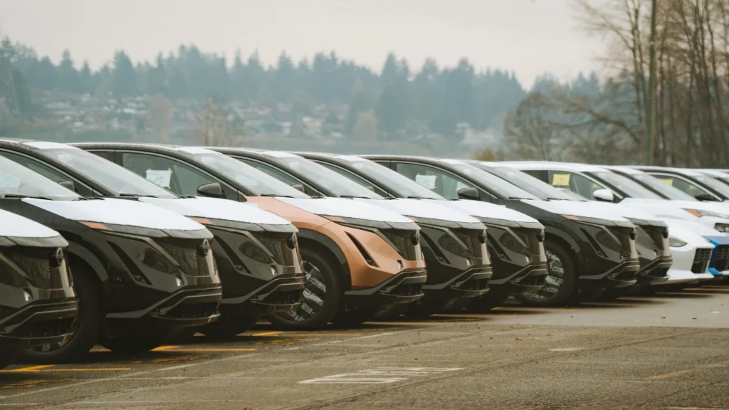 row of cars different ages comparison automotive